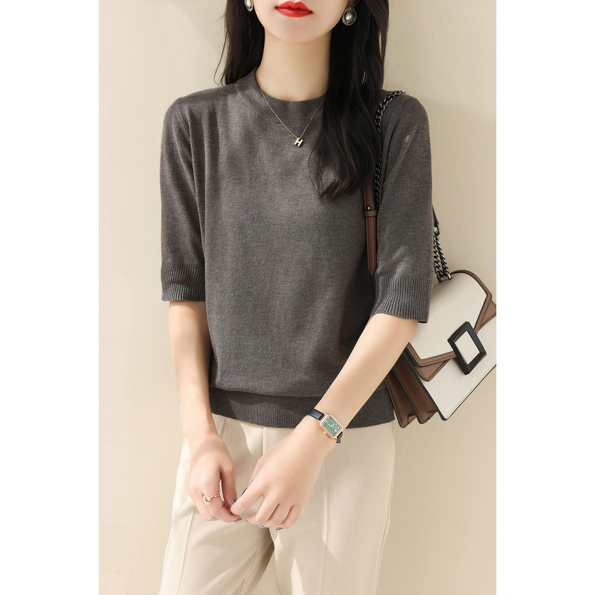 New solid color medium-sleeved temperament intellectual knitted sweater women's clothing 2025 summer half-height round neck five-quarter sleeve loose top