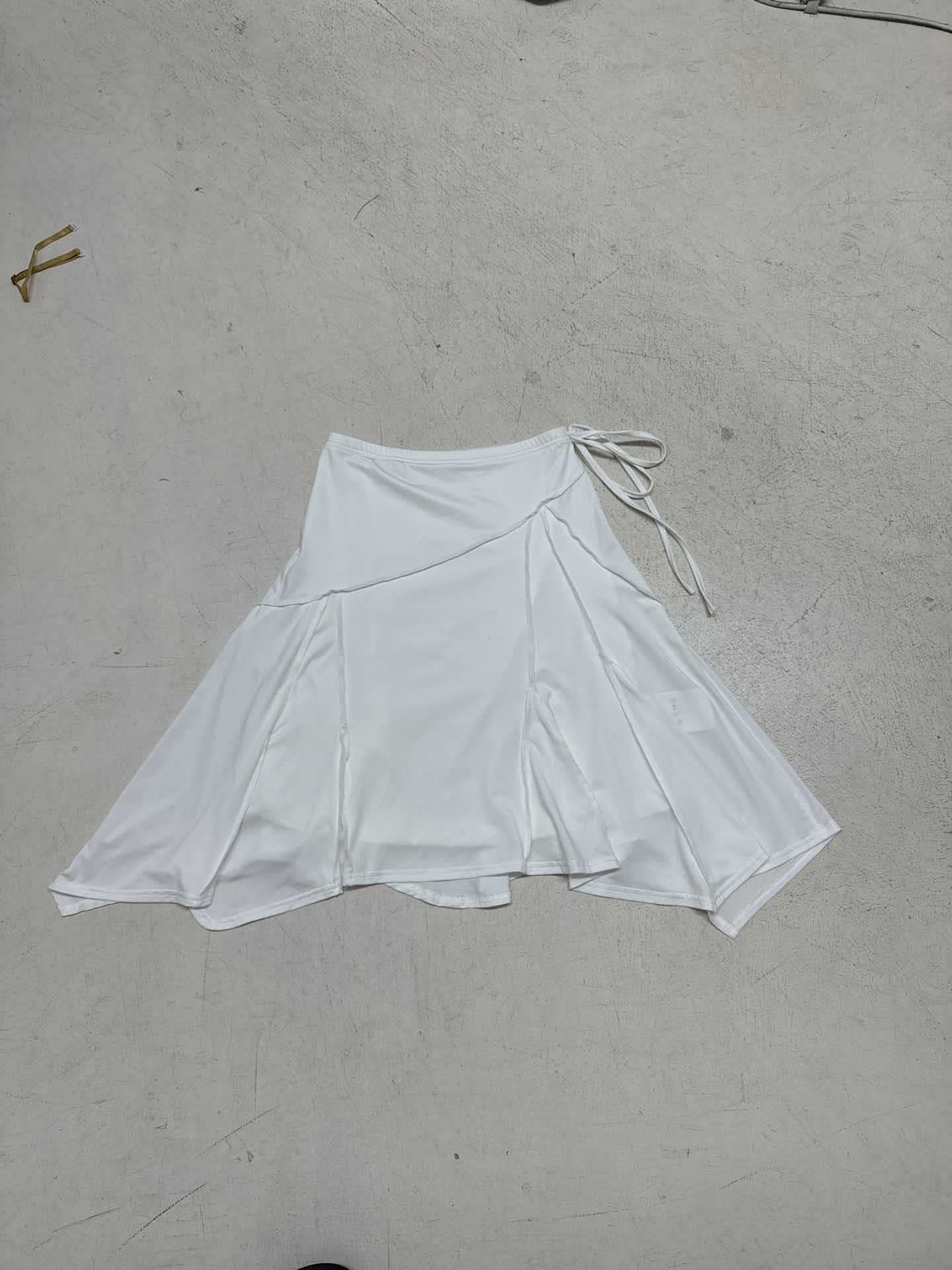 Holiday style light and familiar temperament irregular skirt European and American fashion white simple side strap Spice Girl medium and long skirt