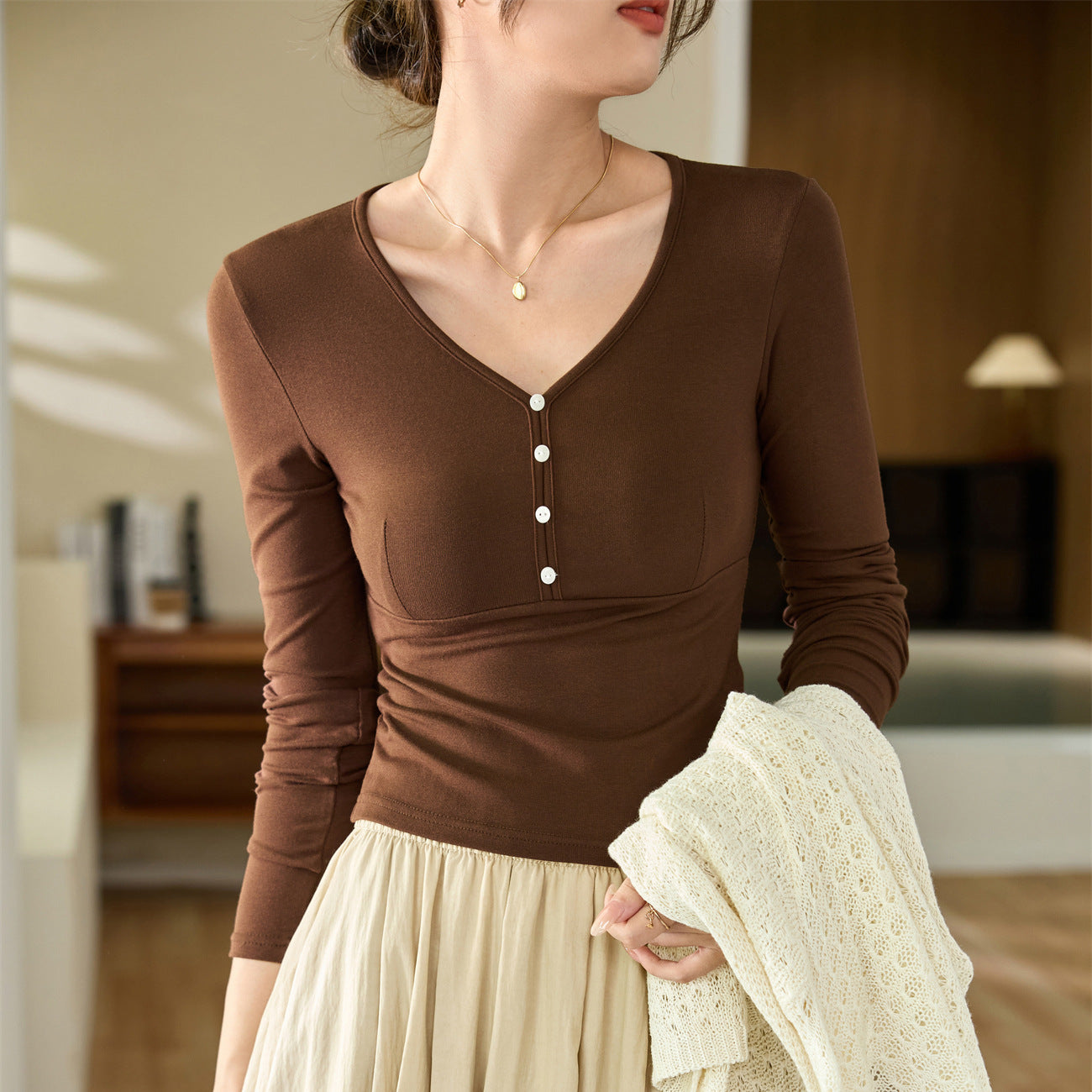 #Quality to do high quality #temperament age reduction design sense T-shirt women's long sleeves 2026 autumn clothes new shell buckle pure desire top