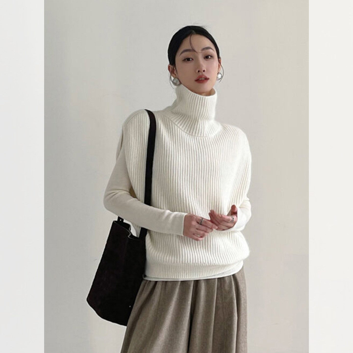 Fashionable foreign style turtleneck sleeveless knitted vest women's autumn and winter loose lazy wind stacked sweater top