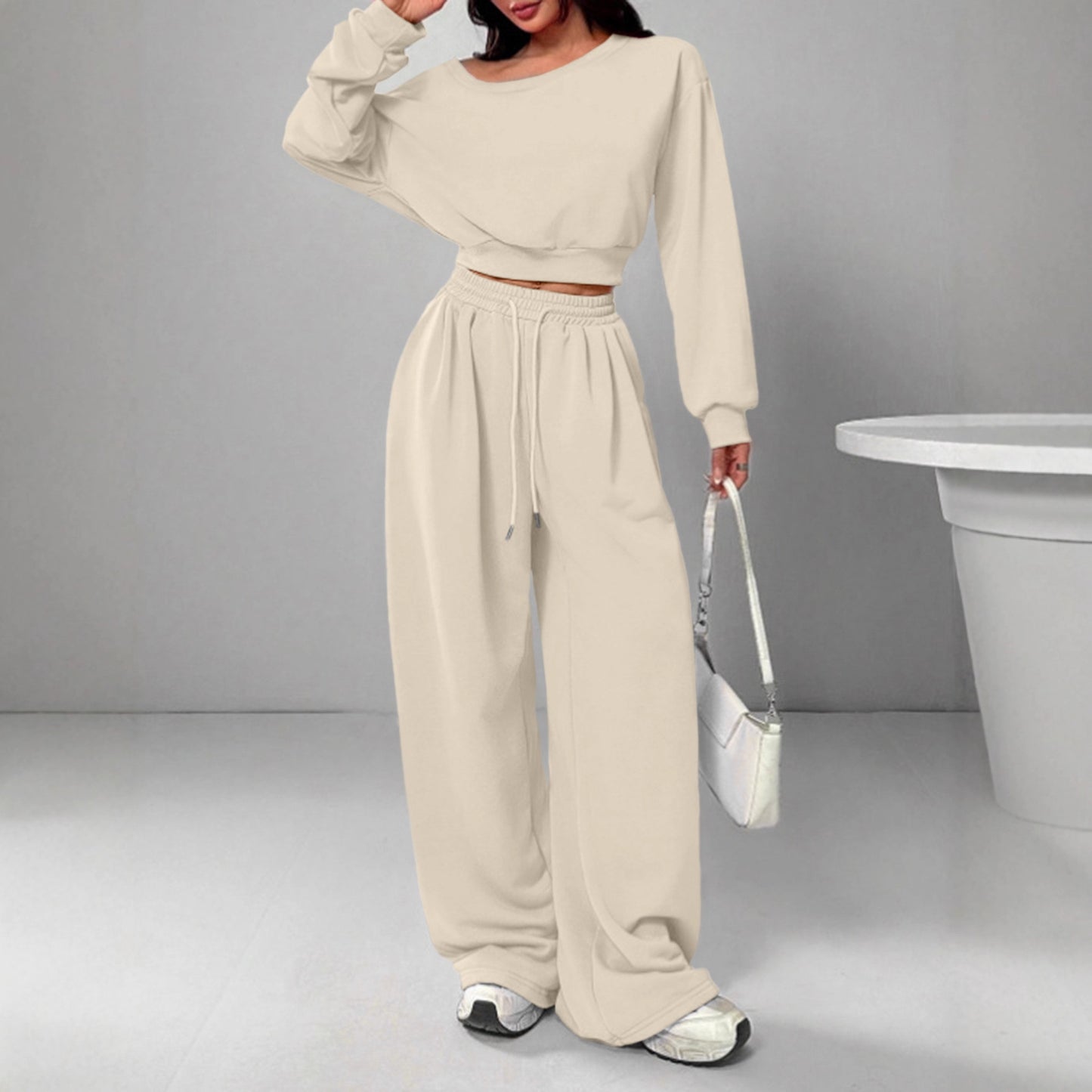 Spot European and American casual suit solid color sweater women's one-word collar off-shoulder loose knitted short long-sleeved suit