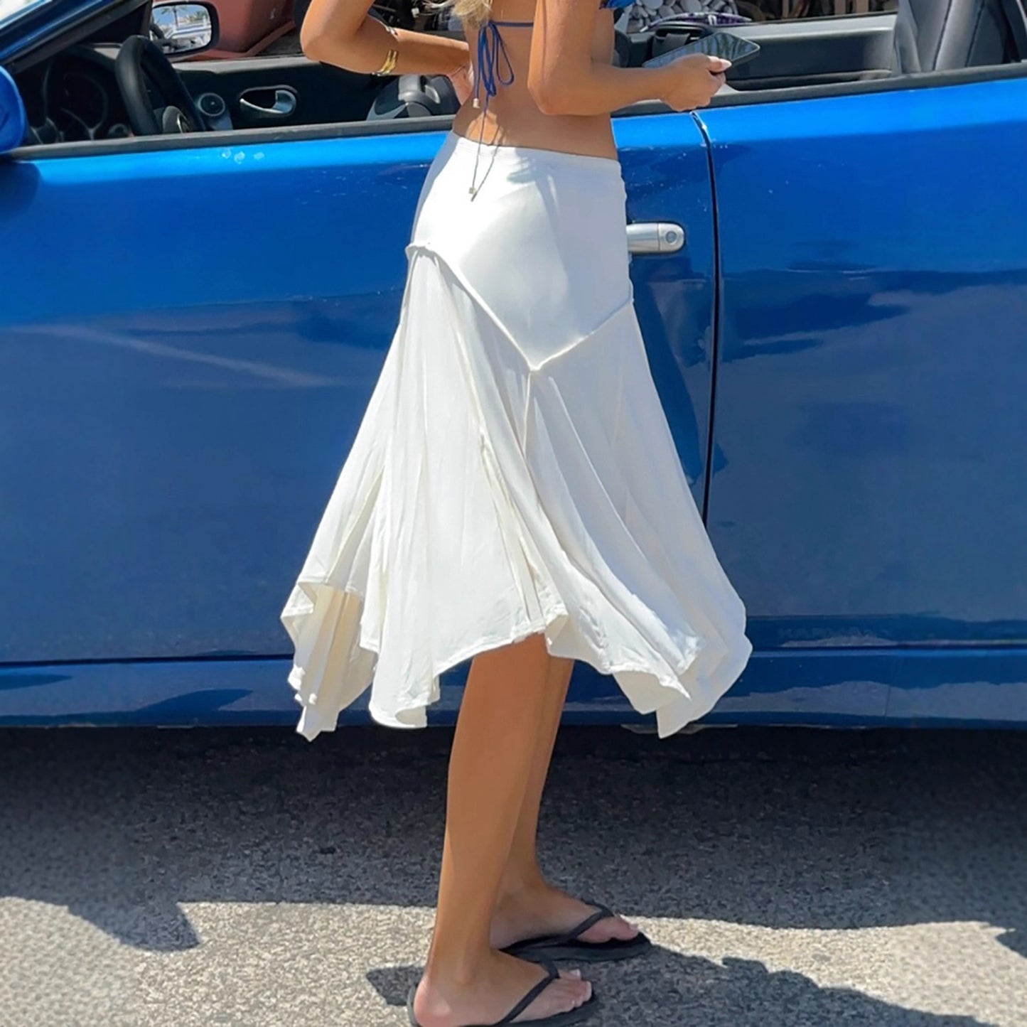 Holiday style light and familiar temperament irregular skirt European and American fashion white simple side strap Spice Girl medium and long skirt