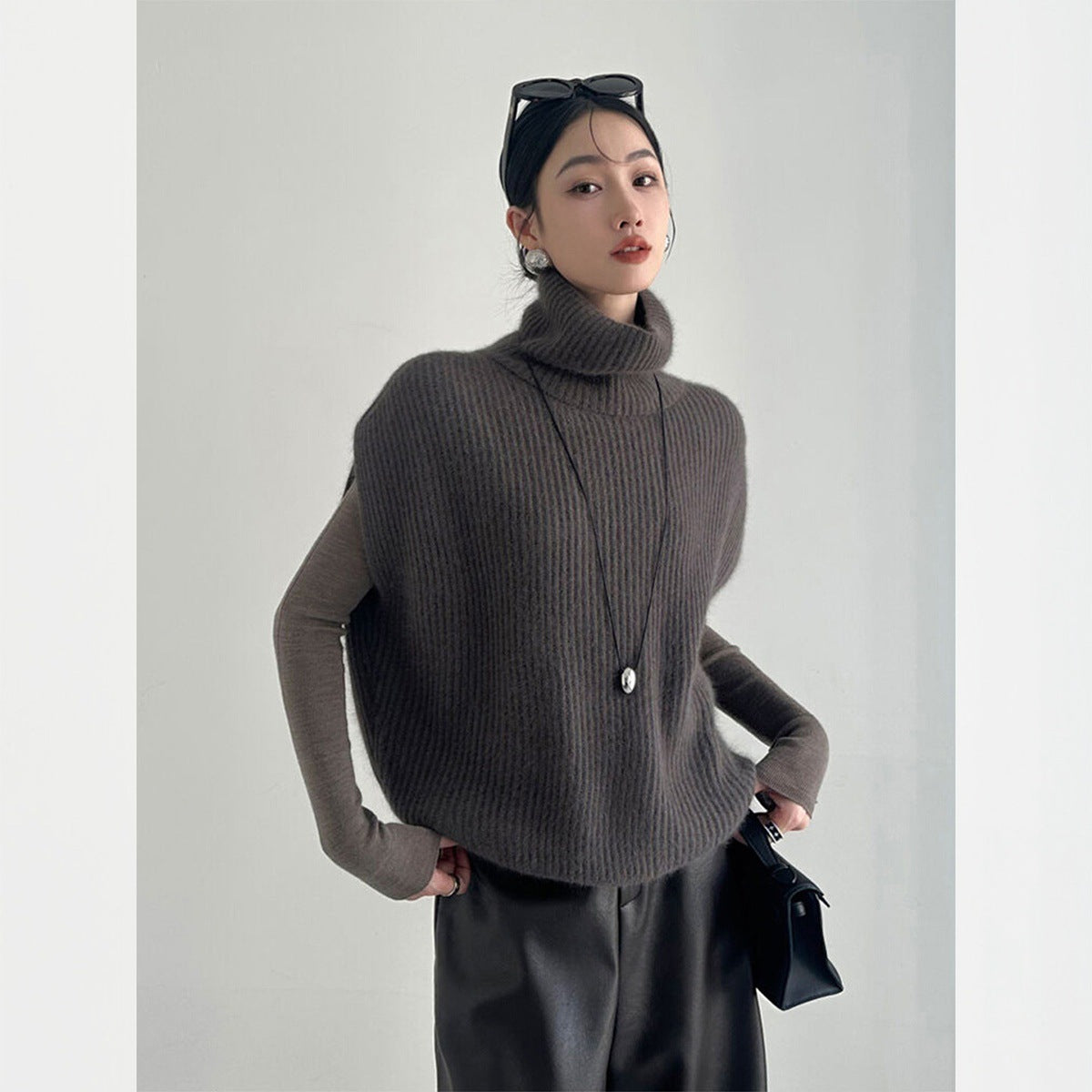 Fashionable foreign style turtleneck sleeveless knitted vest women's autumn and winter loose lazy wind stacked sweater top