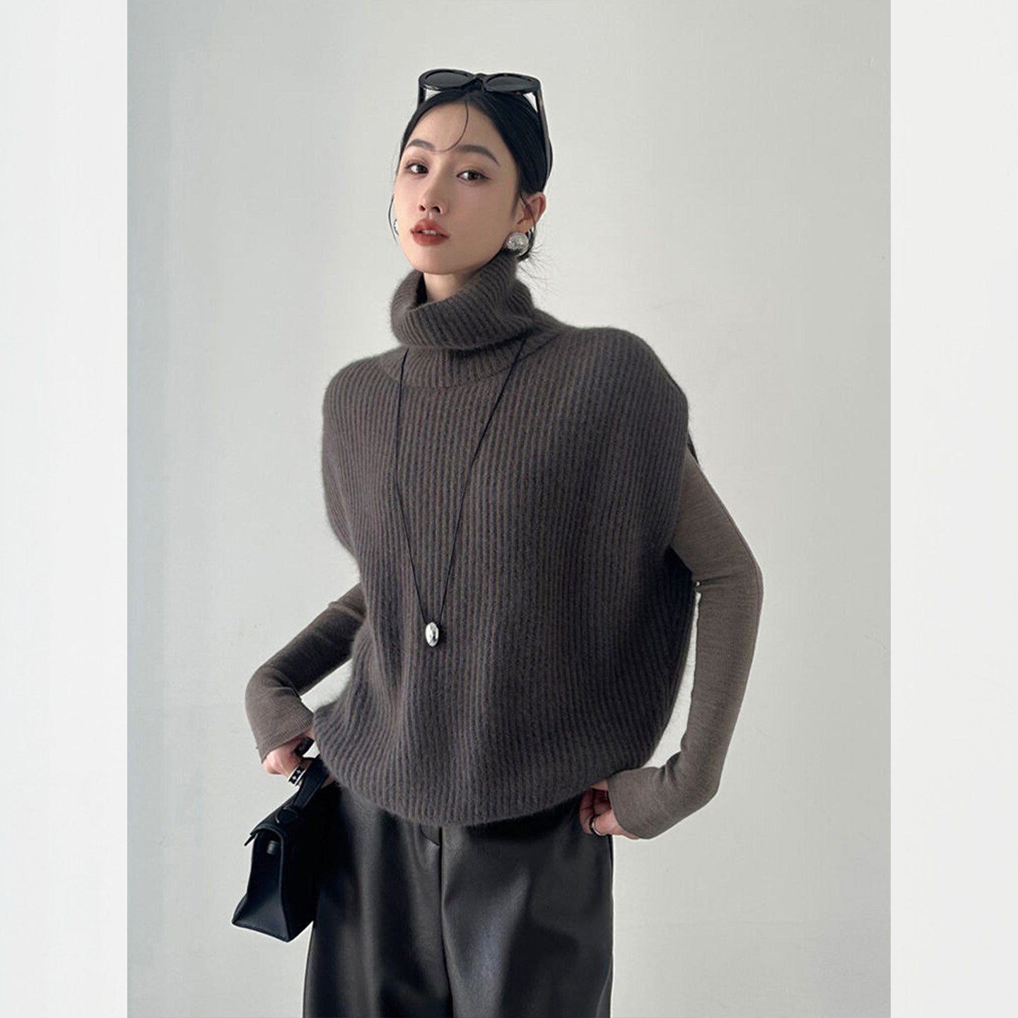 Fashionable foreign style turtleneck sleeveless knitted vest women's autumn and winter loose lazy wind stacked sweater top