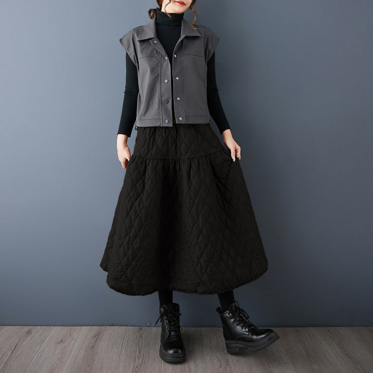 The real shot will be in the autumn and winter of 2025. The new cotton-added warm and thin solid-color A-shaped skirt women's clothing.