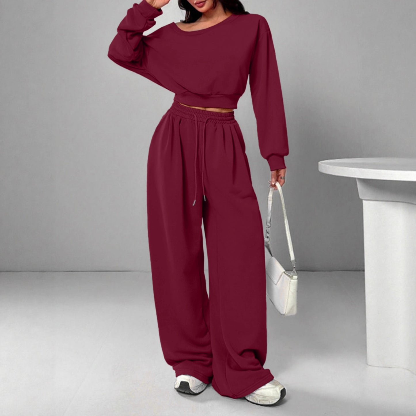 Spot European and American casual suit solid color sweater women's one-word collar off-shoulder loose knitted short long-sleeved suit