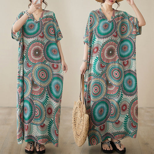 The real shot is the new V-neck cotton silk large size loose literary holiday wind beach dress for women in the summer of 2024.