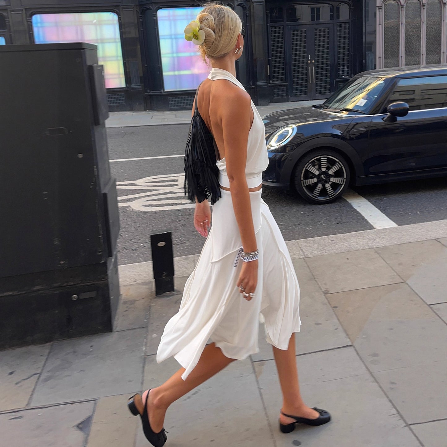 Holiday style light and familiar temperament irregular skirt European and American fashion white simple side strap Spice Girl medium and long skirt