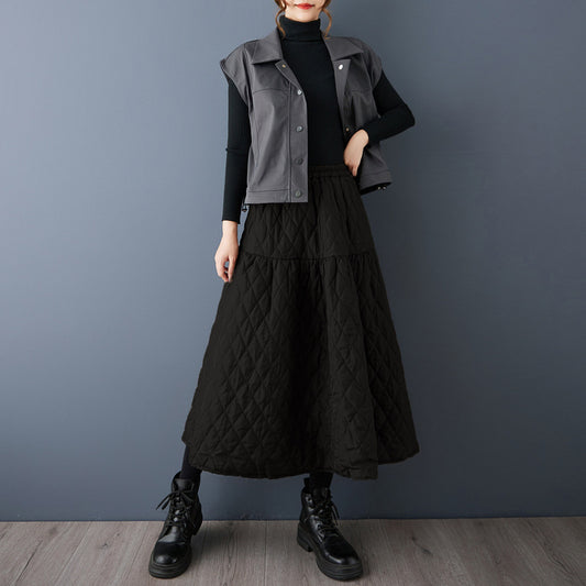 The real shot will be in the autumn and winter of 2025. The new cotton-added warm and thin solid-color A-shaped skirt women's clothing.